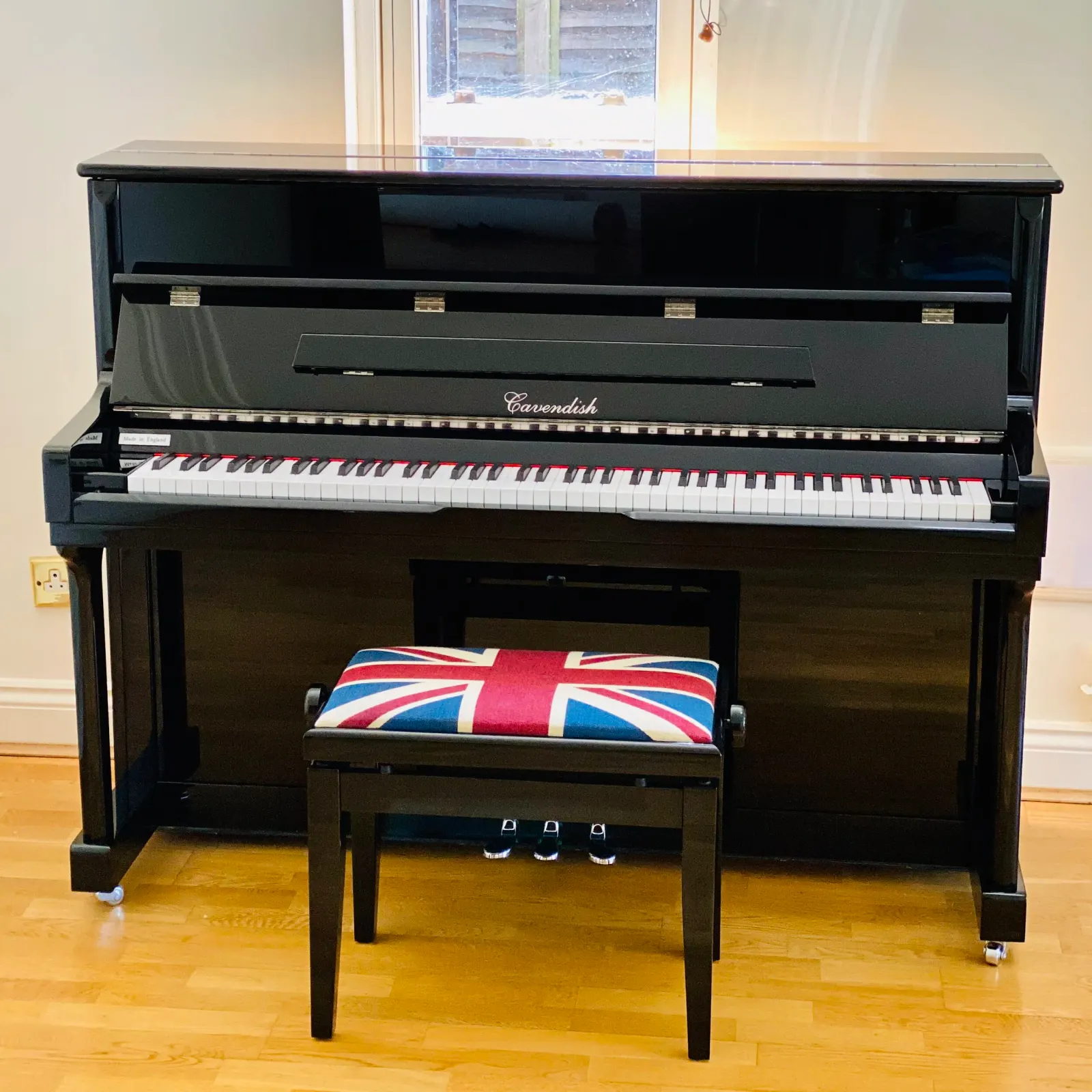 Upright piano wrapped and protected, ready to go into storage